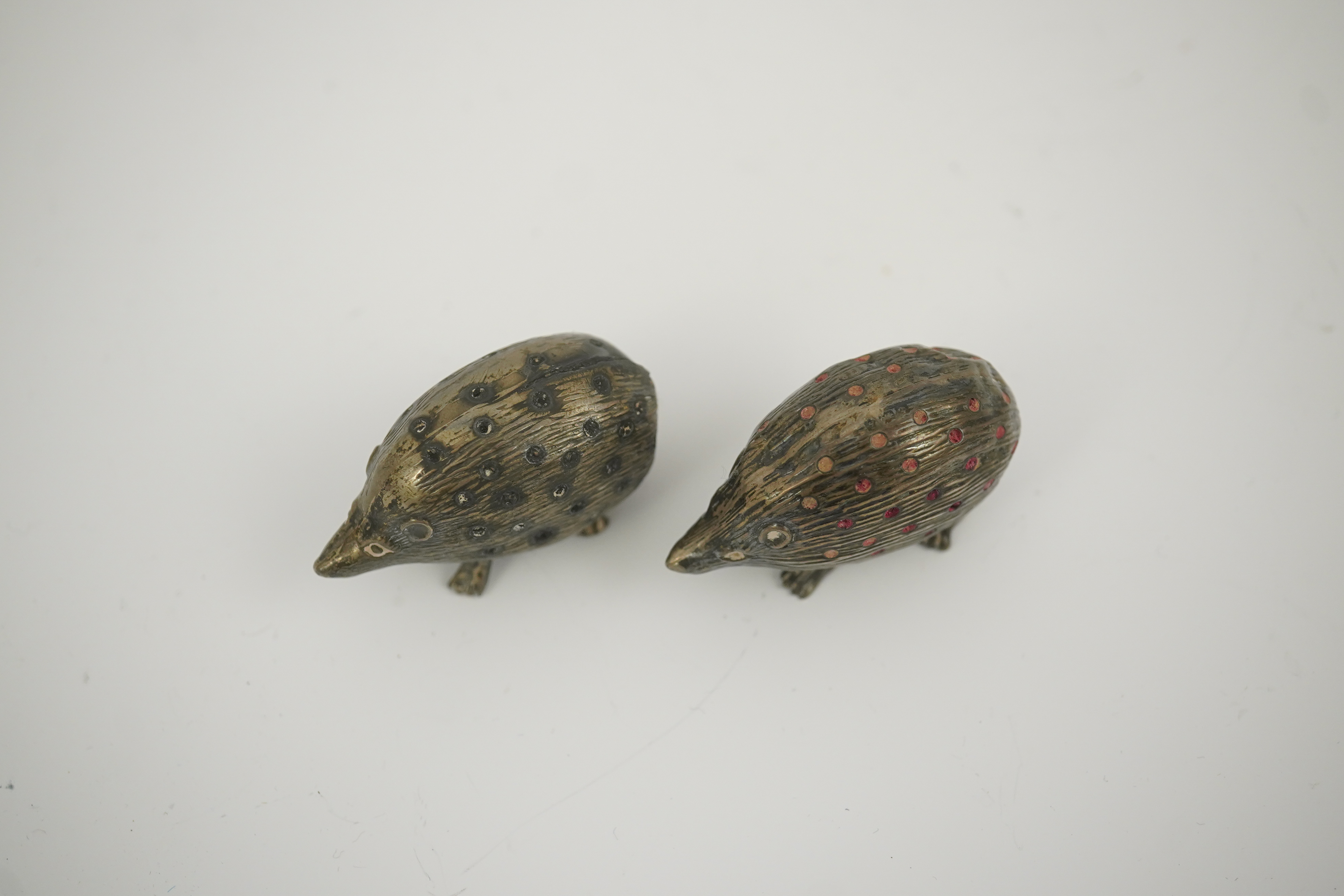 Two Edwardian silver novelty pin cushions, modelled as porcupines